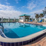 outdoor pool and chaise lounge chairs