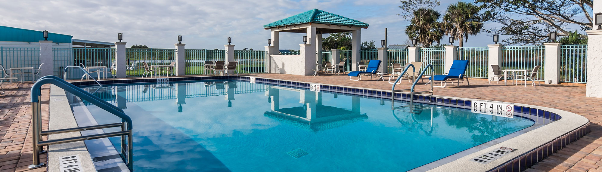 outdoor pool and chaise lounge chairs